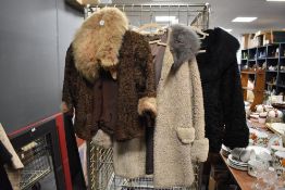 Three vintage ladies coats including two astrakhan coats, both with fox fur and similar collars.
