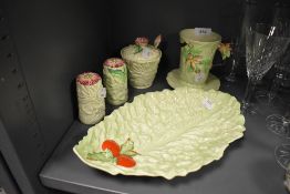 A selection of Carlton ware including salad plate, condiment jar, cruet and mug with saucer.