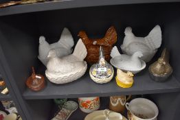 Nine vintage and retro ceramic and glass hen shaped egg and similar storage containers.