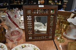 An Indian styled wooden framed and micro mosaic mirror