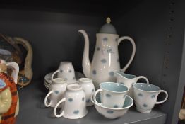 A collection of Susie Cooper 'one o'clocks' coffee service including coffee pot, cups and saucers