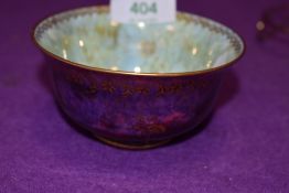 A fairyland lustre bowl by Wedgwood having flambe glaze with butterfly centre