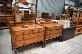 An early 20th Century oak dressing table and set of three bedroom drawers