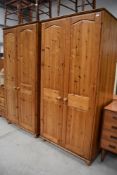A pair of modern pine wardrobes , each width approx. 90cm, height 183cm