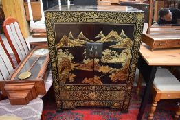 A traditional oriental ebonised side cabinet, dimensions approx. W82 H112 D48