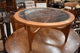A vintage coffee table, stylised circular, G plan or similar, diameter approx. 88cm