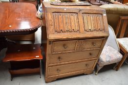 A vintage light oak bureau approx width 76cm height 100cm