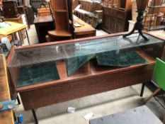 Two large glazed shop counter cabinets , rosewood effect laminate, width approx. 183cm and 168cm