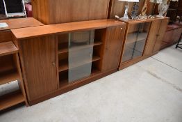 Two vintage sapele cabinets with glazed bookshelf and cupboard sections, each width approx. 136cm