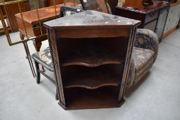 A mid C20th oak open shelf corner wall cuoboard