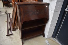 An early 20th Century oak bureau with bookshelf under, width approx. 76cm