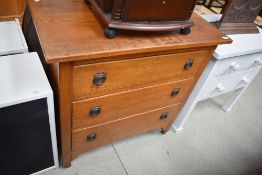 An early 20th Century golden oak chest of three drawers, width approx. 83cm