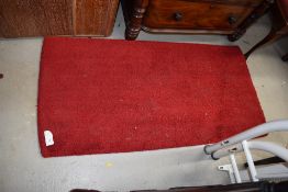 A vintage wool fireside rug, approx 140 x 70cm