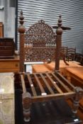An Anglo Indian style low seat carved chair