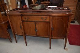 An Edwardian mahogany and inlaid sideboard having mirror back , on square tapered legs, width