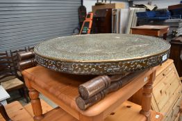 An early 20th Century Chinese brass top table with turned wood frame, diameter approx. 60cm