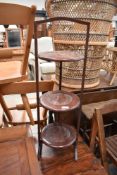 An early 20th Century mahogany folding cake stand