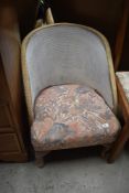A vintage woven fibre style nursing chair