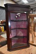 An early 20th Century mahogany corner wall display