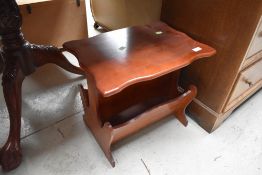 A modern magazine table having shaped top