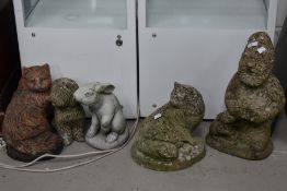 A selection of concrete garden ornaments, include gnome and animals