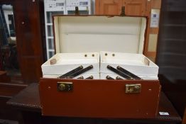 A mid century leather clad portable sewing box