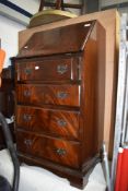 A reproduction flame mahogany dwarf bureau