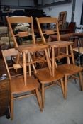 A set of five modern beech kitchen chairs in the traditional railback design