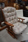 A vintage Duatalier oak framed slider rocking chair