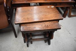 A nice quality reproduction nest of three occasional tables, clover decoration to end