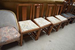 A set of mid 20th Century stained frame dining chairs with later upholstery