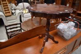 A reproduction continental style occasional table