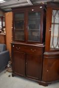 An early 20th shallow bookcase, with double cupboard under, width approx. 78cm