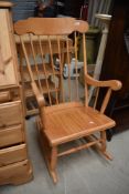 A traditional beech rocking chair