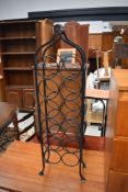 A wrought iron wine rack, 12 bottles