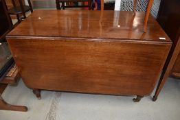 A late C19th/early C20th drop leaf dining table on turned legs, approx w 106cm