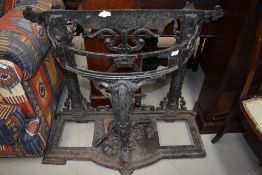 A C19th cast iron Coalbrookdale style frame hall stand, having cabriole front support and paw foot