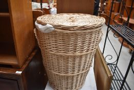 A wicker work laundry basket