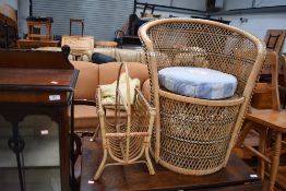 A vintage wicker chair and magazine rack