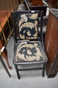 An early C20th dark stained bedroom having later upholstery