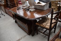 A late C20th oak effect dining table on refectory style base, approx 170cm, and a set of four