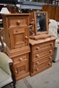 A selection of modern pine bedroom furniture comprising four drawer chest , pair of bedside cabinets