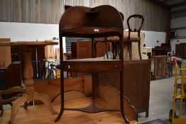 A 19th Century mahogany corner washstand, central frieze and two dummy drawers , line inlay to