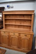 A natural pine dresser, approx width 158cm, height 183cm, depth 53cm