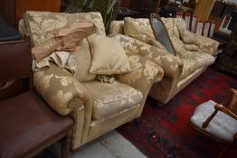 A modern floral gold two piece lounge suite