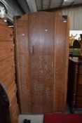 A 1930s limed oak compact bedroom suite comprising , single wardrobe, bed frame, chest of drawers