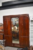 An early 20th Century mahogany triple mirror door wardrobe, width approx. 154cm