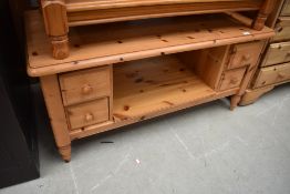 A modern pine Ducal or similar TV table