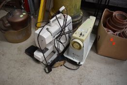Two electric sewing machines