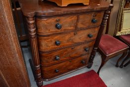 A gorgeous 19th Century chest of two over three drawers, fluted column and semi bow front, width